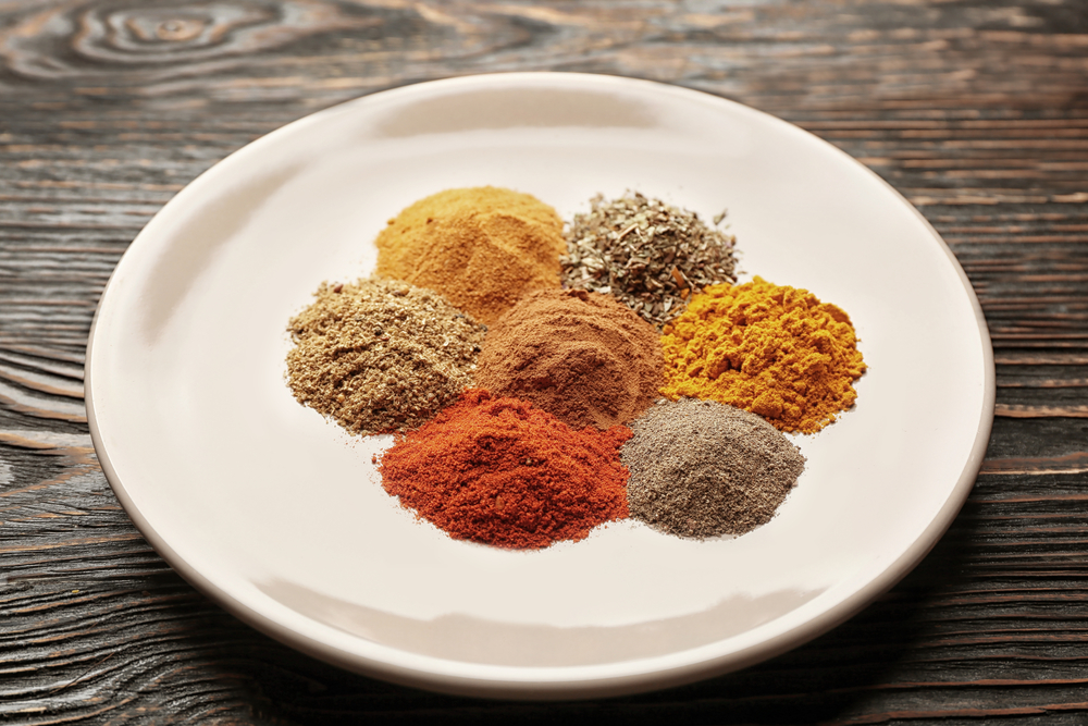 Photo of spices on a plate to create a dry rub for ribs. 