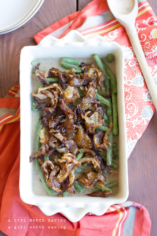 gluten free green bean casserole in a serving dish with a spoon to the side 