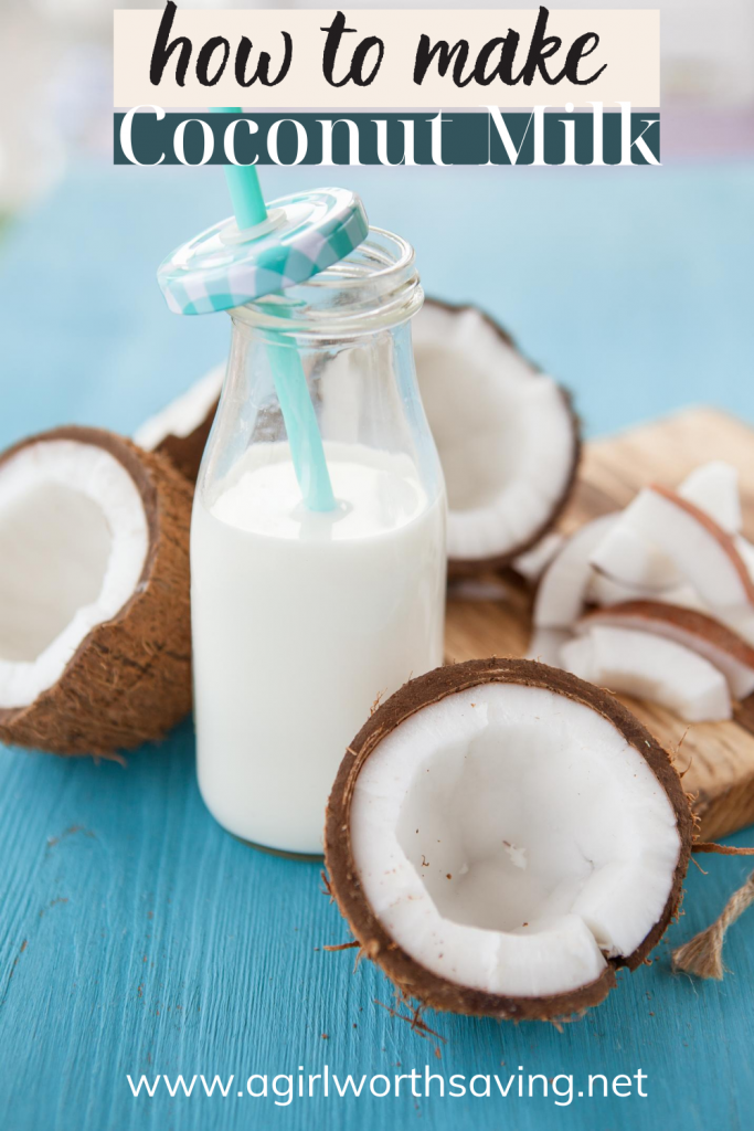 glass of coconut milk with coconuts around it