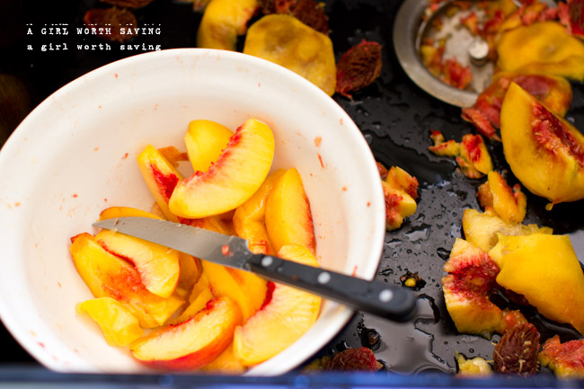 Slices peaches in the large bowl in a the in sink in this tutorial on How to Freeze Peaches